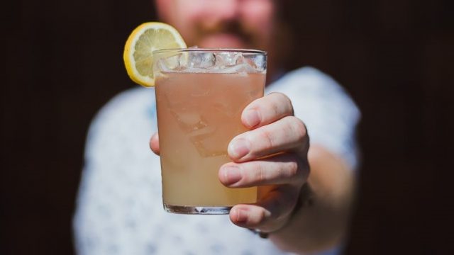 gilr holding a summer cocktail
