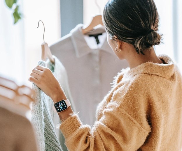 girl holding up clothing