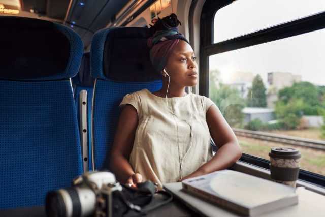 young woman sitting alone in a train