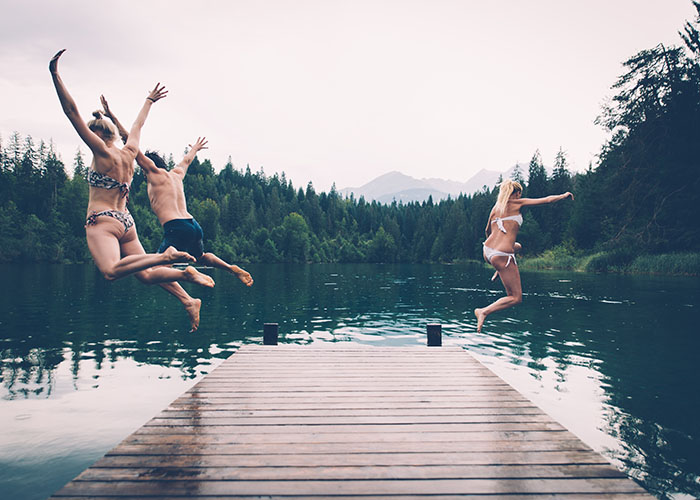 Best Labour Day Weekend Getaways From Vancouver Group of friends having fun at the lake in the morning